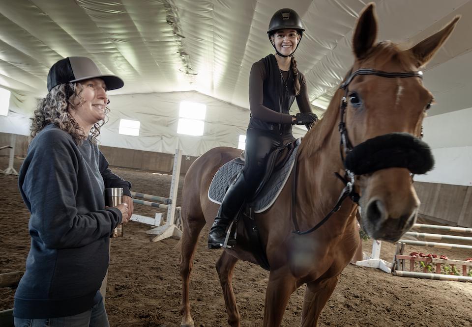 Magali Morin of Ecuries MD stables wth Elizabeth Gruenwald on horse of hudson quebec